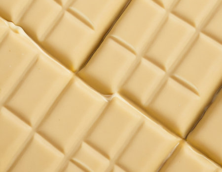 close up of a white chocolate bar as a background, top viewの素材