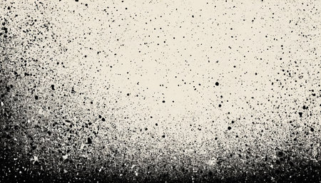 A textured background with a gradient of black ink splatters on a light beige surface. The splatters are denser and darker at the bottom, gradually becoming sparser and lighter towards the creating a distressed and organic feel.の素材