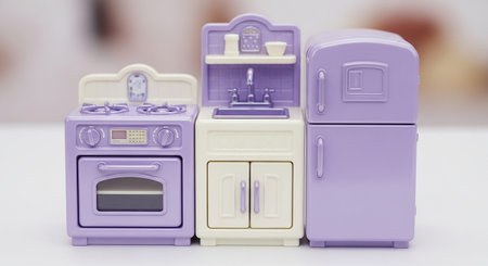showcases a set of three miniature kitchen appliances designed for dollhouse play. From left to right, there is a lavender oven with a stovetop, a cream and lavender sink unit with cabinets, and a tall lavender refrigerator. All pieces are in a soft pastel palette of lavender and cream, featuring detailed like knobs, buttons, and faux tile backsplashes. The style is charming and reminiscent of vintage toys.の素材