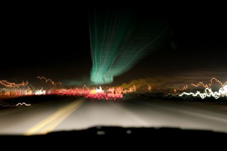 Shot of the highway and car lights taken from the car with a tripod while travelling.