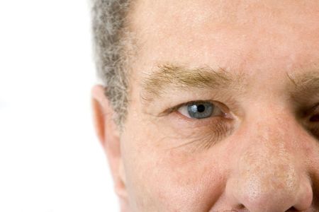 Isolated close up on the face of an elder man