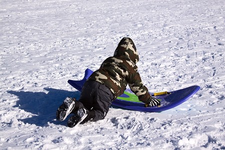 Little Boy Sledding down the Hill - Winter Scenes