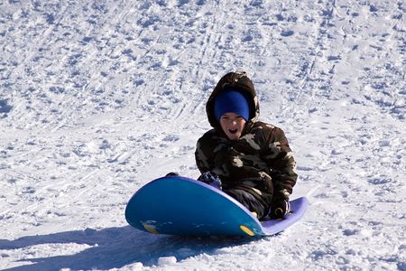 Little Boy Sledding down the Hill - Winter Scenes