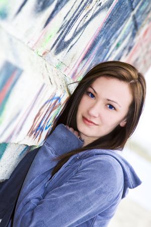 Close up on a Beautiful Teenager by the wallの写真素材