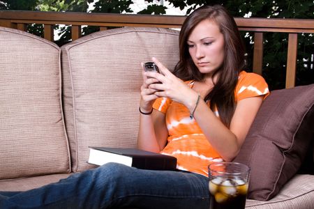 Close up on a Beautiful Girl Texting Outsideの写真素材