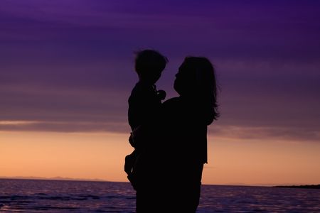 Mother and Son on the Beach - Silhouette Shotの写真素材