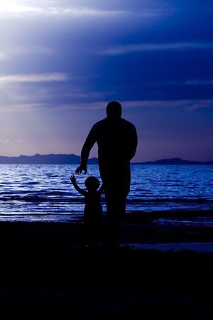 Father andSson on the Beach - Silhouette Shotの写真素材