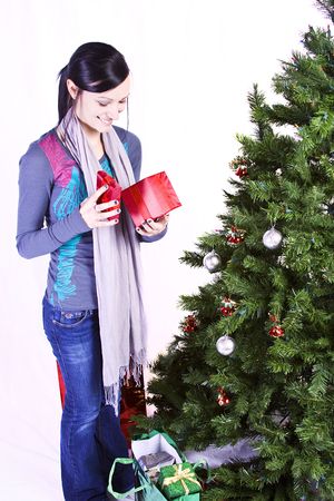 Beautiful Girl by the Christmas Tree - Isolated の写真素材