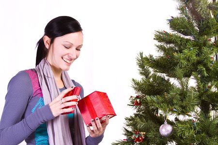 Beautiful Girl by the Christmas Tree - Isolated の写真素材