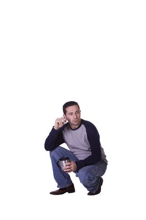 Crouched Casual Stressed Man Smoking and Drinking Coffee - Isolated Backgroundの写真素材