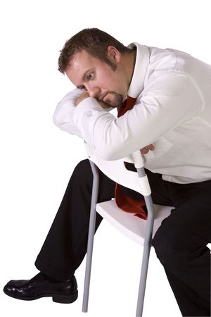 Isolated Stressed Businessman On a Chair - White Backgroundの写真素材