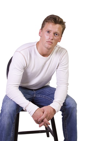 white man sitting on chair relaxed-white backgroundの写真素材