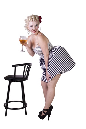Beautiful pinup retro girl with wine enjoying cool air from fan - Isolated White Backgroundの写真素材