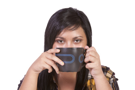 Beautiful  Teenager Girl Drinking Coffee at Homeの写真素材
