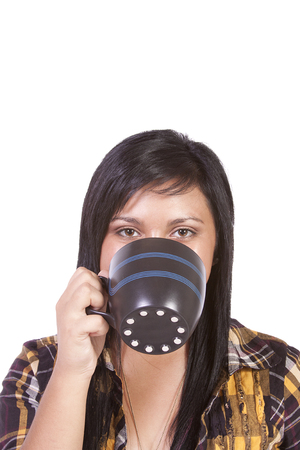 Teenager Drinking Coffee Looking at the Camera - Isolated Backgroundの写真素材