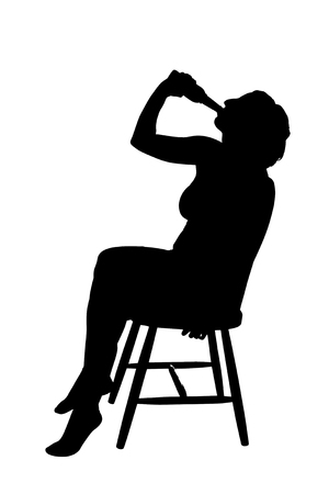 Silhouette of a woman on a chair drinking beerの写真素材