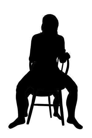 Silhouette of a woman on a chair の写真素材