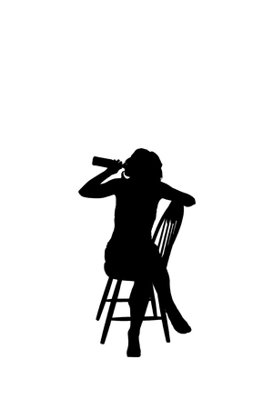 Silhouette of a woman on a chair drinking beerの写真素材