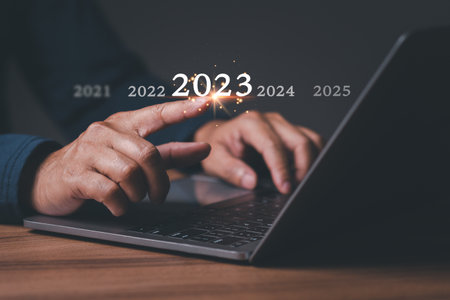 Man has idea plan manage money in 2023. Person businessman has goal to business 4.0 in new year 2023...