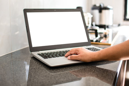 Closeup, A woman's hand is typing on a laptop keyboard to search out how to cook. notebook computer...