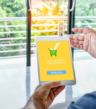 The tablet screen displays a Your payment Was successful message to confirm payment is complete for...