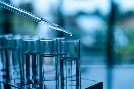 Chemistry experiments in science labs. Drop chemical matter into a test tube. Many test tubes are...