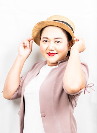 Portrait of young woman Asia wearing hat and smile, look at cameraの写真素材