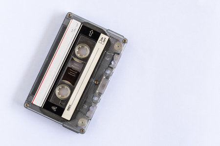 old classic tape which is technology from the 90s, used for recording music or sounds, placed on a...