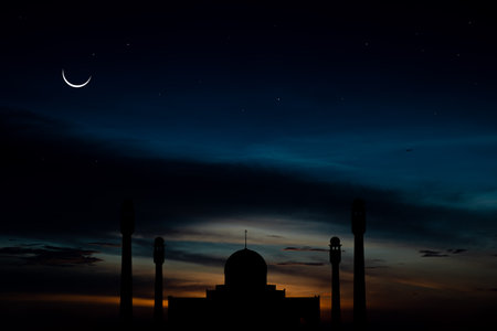 Concept the crescent moon the symbol of Islam begins the eid al Fitr. Seeing the moon in the night sky. The evening sky and the vast river in darkness are beautiful.の写真素材
