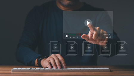Businessman making video content of business 4.0 in 2023. Man using hand and keyboard for streaming online on virtual screen, watching video on internet, live concert, show or tutorial, content onlineの写真素材