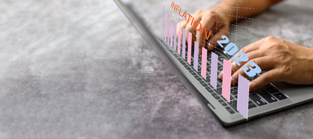 A businessman is using laptops in hyperinflation situations around the world. Concept, finance,...