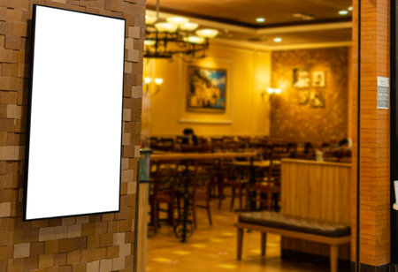 Blank white broad in front of a food shop in a shopping center, concept, advertisement, promotion, information. closeup, selective focus, blurred backgroundの写真素材
