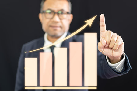 Businessman pointing to the peak of interest ratesの写真素材