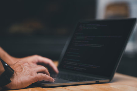 programmer typing keyboard laptop to write script code, compiler, encode, debug, developer...