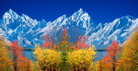 Colorful autumn landscape with lake and snow-capped mountains.の写真素材