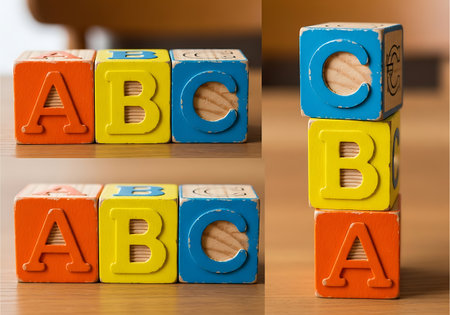 Colorful wooden alphabet blocks educational toys for children learning the ABCs stacking blocks on wood surfaceの素材