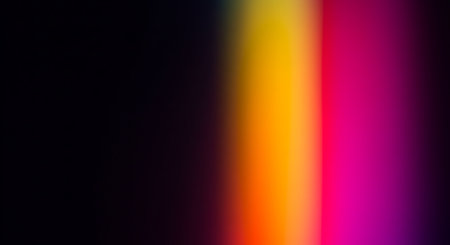 A striking abstract image featuring a vertical light leak effect, displaying a smooth transition of vivid colors from yellow and orange to pink and purple, set against a dark backdrop.の素材