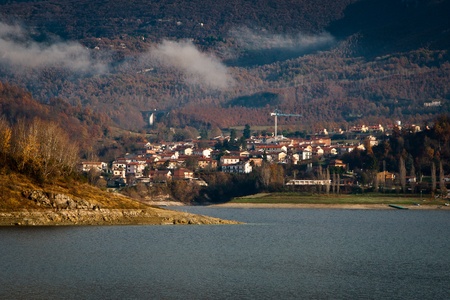 View of Borgo San Pietro from Lago del Salto in a misty morning
