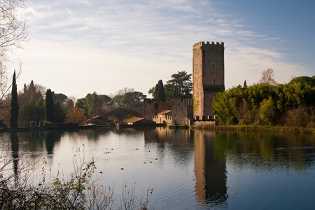 View of gardens of Ninfa from the paceful lake in a cold morningの写真素材