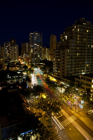 Aerial view of Honolulu streets at night with lighted buildings and car light trailsのeditorial素材