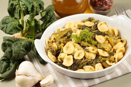 Traditional orecchiette pasta with turnip tops. Spicy recipe from Apulia, in southern Italyの写真素材