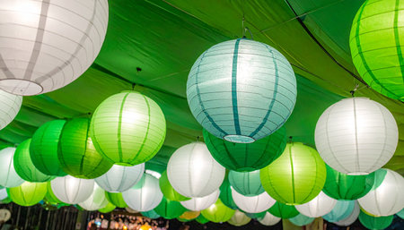 Colorful paper lanterns hanging on the ceiling of the building.の素材