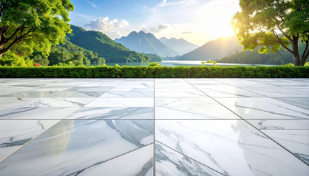 white marble floor and view of beautiful lake and mountain landscape at sunsetの素材