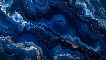 Abstract deep blue agate slice with swirling golden veins and white accents creating a marbled texture.の素材