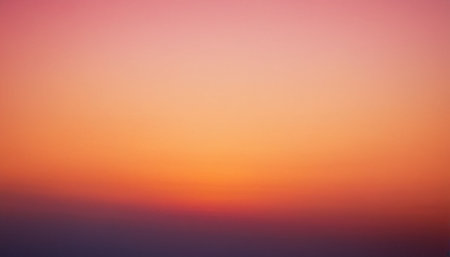 A soft gradient flows from light pink and orange at the to a darker purple and blue at the bottom.の素材