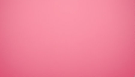 Pink showing bright pink color background with subtle soft lighting and a smooth even surface texture.の素材