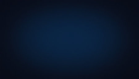 A dark navy blue background a soft gradient with a subtle vignette effect, creating a moody ambiance.の素材