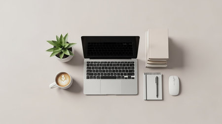Mouse showing down view of open laptop with coffee plant mouse books and notebook. resolutionの素材