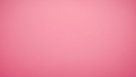 A soft, light pink background exhibits a smooth gradient and a very subtle texture, illuminated by gentle ambient light.の素材