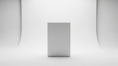A plain white rectangular box is centered on a seamless white cyclorama background in a minimalist studio product shot.の素材